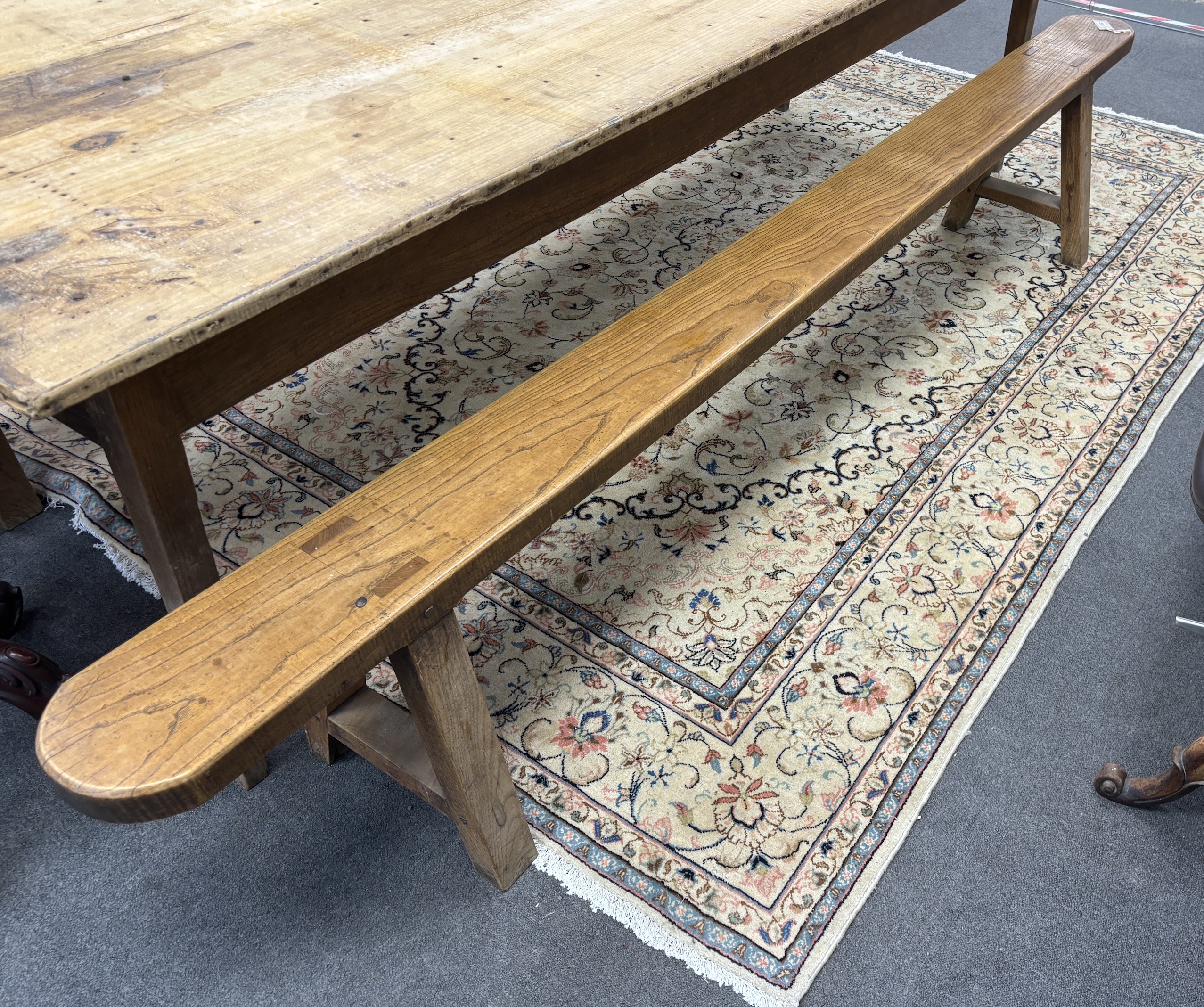 A pair of 19th century elm benches, length 280cm, height 48cm